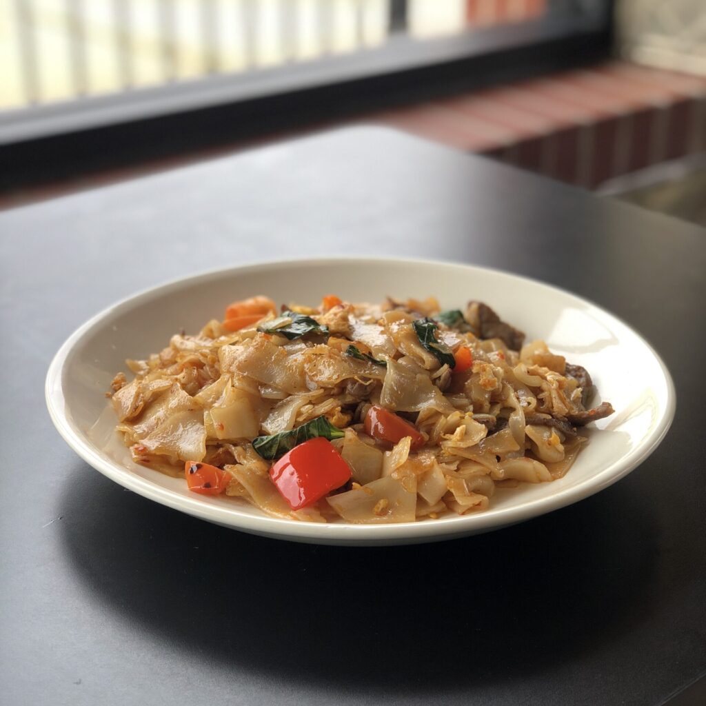 Best Hot Pepper Noodle in Chicago. Served with chicken, peppers, onion, and thai basil. Stir fried in spicy basil sauce.